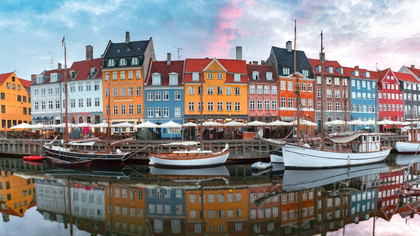 Nyhavn at sunrise in Copenhagen, Denmark.